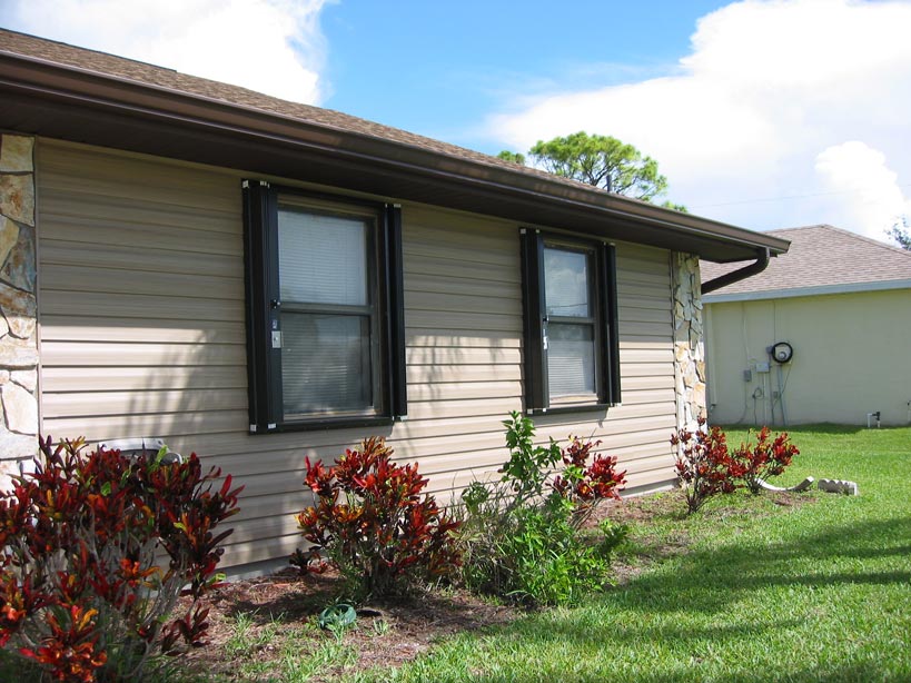 hurricane accordion shutters unfold protect windows