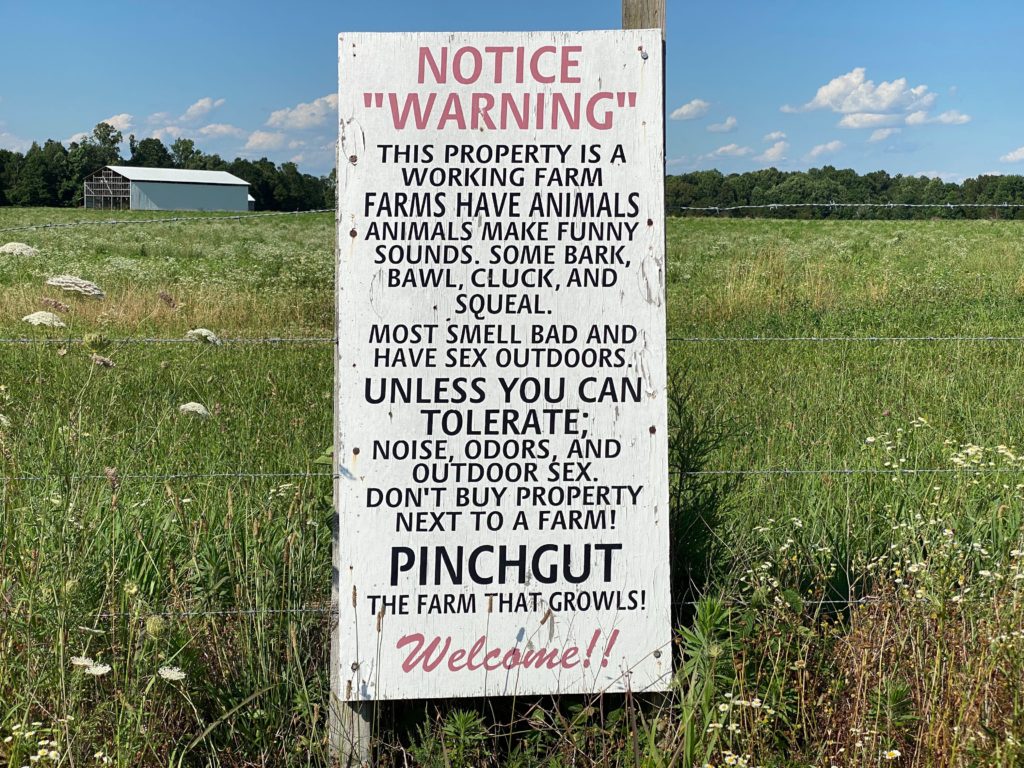 A funny farm warning sign