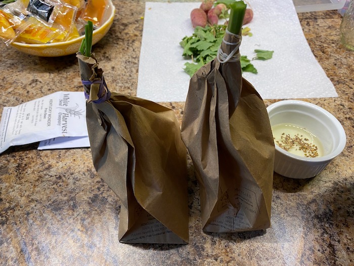 Harvesting seeds in a paper bag