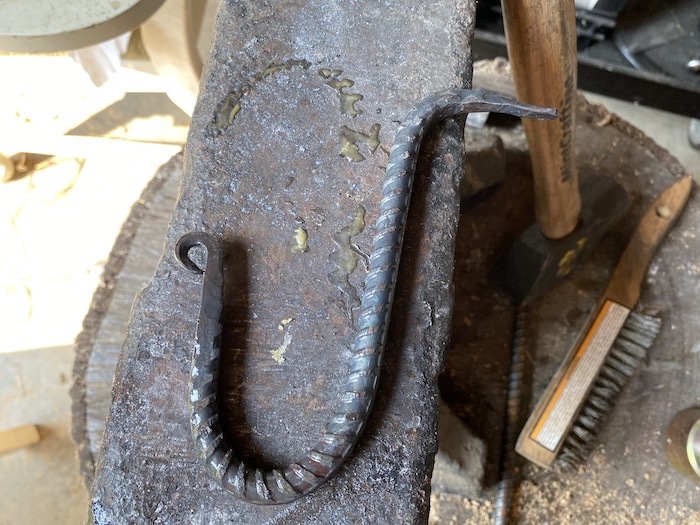 Hand-forged hook covered in beeswax